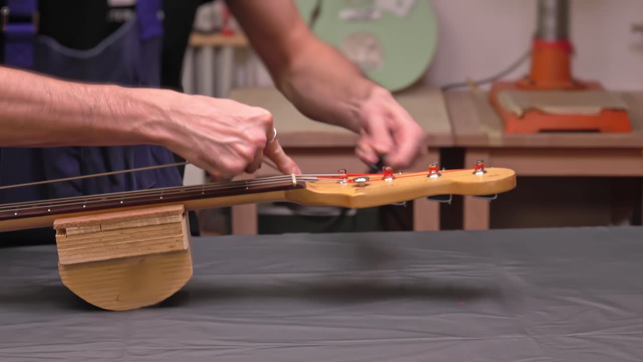 Putting new string on an electric guitar