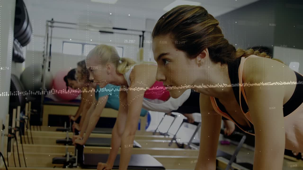 Woman in pink tank shifting reformer leg lifts into plank after cue, waveform showing pilates core