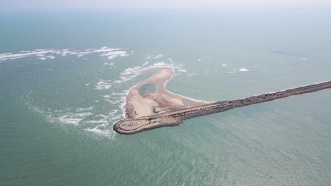 picturesque aerial drone shot of dhanushkodi, with the last road cutting through its deserted beauty.