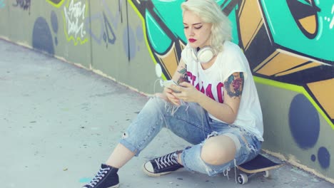 young urban woman listening to music