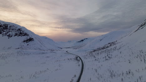 road in the norwegian mountains during winter