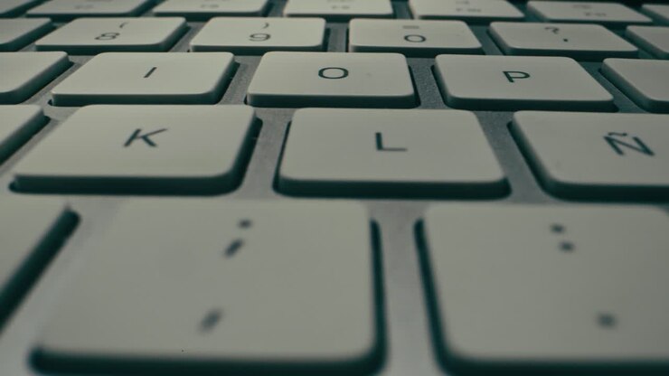 This is a detailed view of a sleek, modern keyboard that showcases its smooth keys and elegant overall design