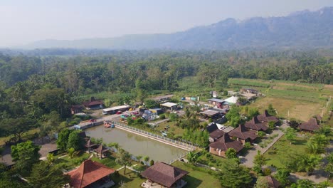 aerial view of "balkondes wanurejo" and junkyard pank in sunny morning and hills on the background