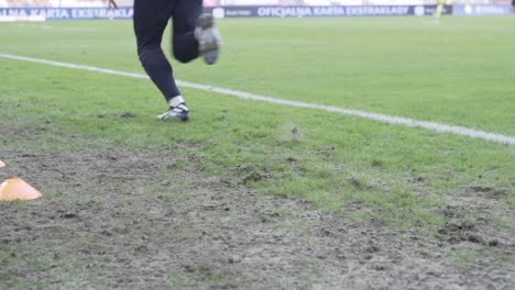 a-professional-football-players-warm-up-in-slow-mo