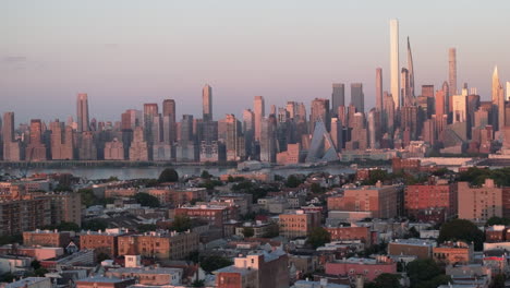 aerial view of suburban new jersey at dusk. shot with the new york city skyline in the background.