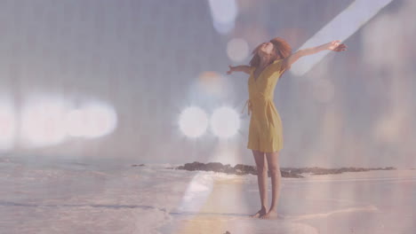 on sunny beach, woman in yellow dress joyfully stretching arms, feeling free