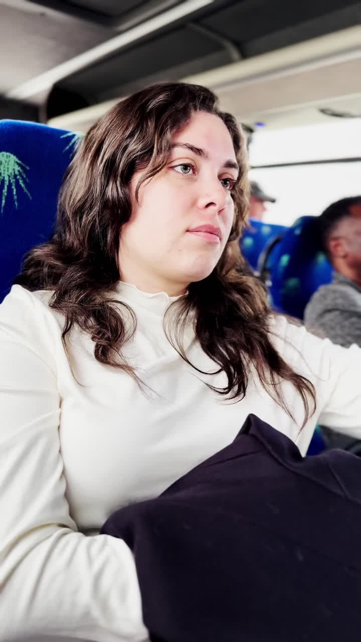 Young Woman Commuting on Public Bus