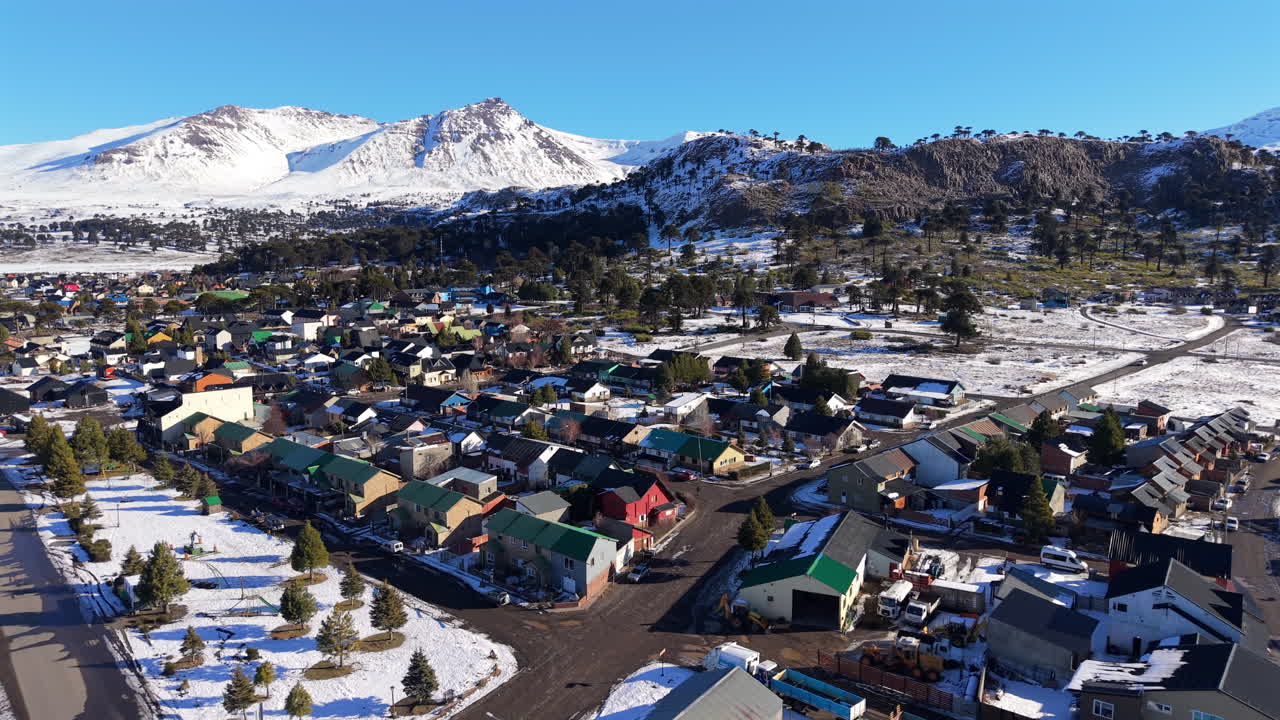 Aerial view of the snowy mountain Caviahue village on a clear winter day, Neuquén, Argentina