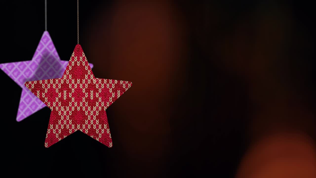 los adornos de las estrellas de navidad se mueven en el fondo de bokeh.
