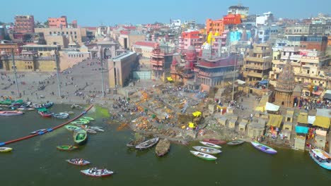 AERIAL-view-of-Dashashwamedh-Ghat,-Kashi-Vishwanath-Temple-and-Manikarnika-Ghat-Manikarnika-Mahashamshan-Ghat-Varanasi-India