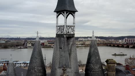 the bordeaux city gate at porte-cailhau france overlooking the garonne river, aerial drone tilt down lift reveal shot