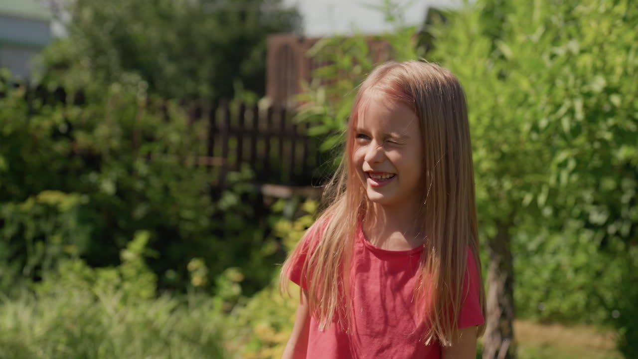 Joyful Sunny Garden, Bright Girl Laughs Outdoors Happily, Cheerful Young Woman In Green Garden Smiling Broadly, Happy Girl With Radiant Smile Amidst Lush Garden Surroundings Enjoying Playfulness