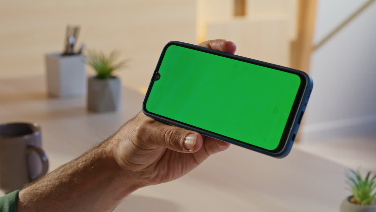 Smartphone with Green Screen on Desk