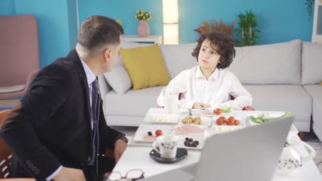 Curious-boy-asks-his-father-questions-while-having-breakfast.-Happy-father-and-son.