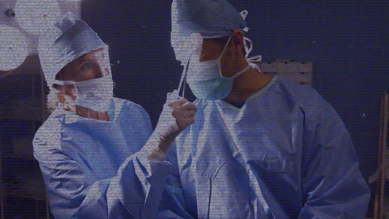Senior female surgeon glancing at colleague and handing suction tool for surgical procedure
