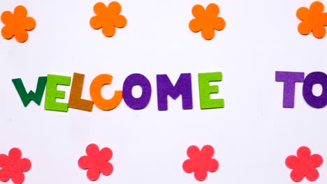 the word welcome to. the word is written in dancing font.