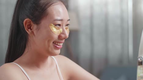 woman with gold eye patches
