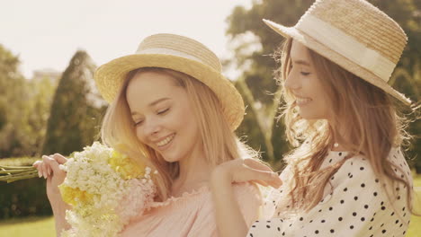 two friends enjoying a sunny day in the park