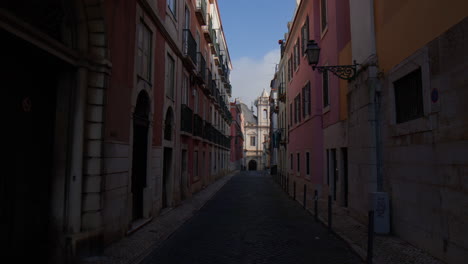 empty narrow and cobbled street at the old town in lisbon, portugal