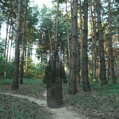 halloween horror man with black cape walking in forest
