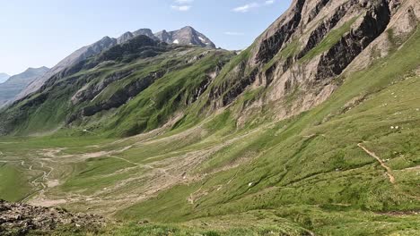 revealing view over a wast green alpine valley in northern italy in the alps