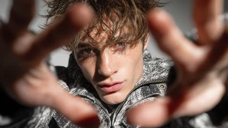 fashion model reaching towards camera in slow motion