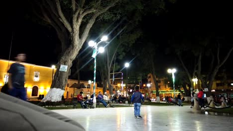 full hd night motion lapse in the plaza de armas of huanuco city from peru. pan from left to right wide angle.