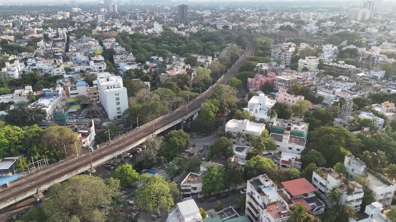 A breathtaking drone flight over Mylapore local train track and its surroundings