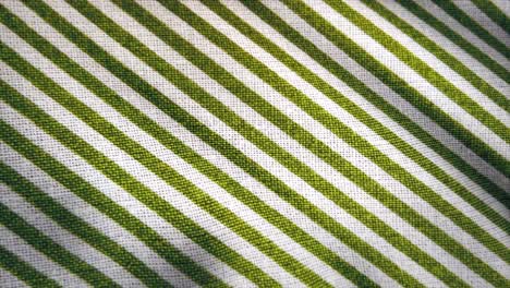 close up of green and white striped fabric