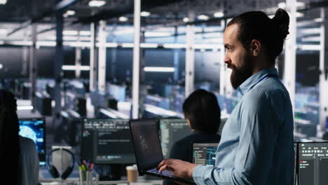 server room technician using ai llm chatbot to review infrastructure diagnostics