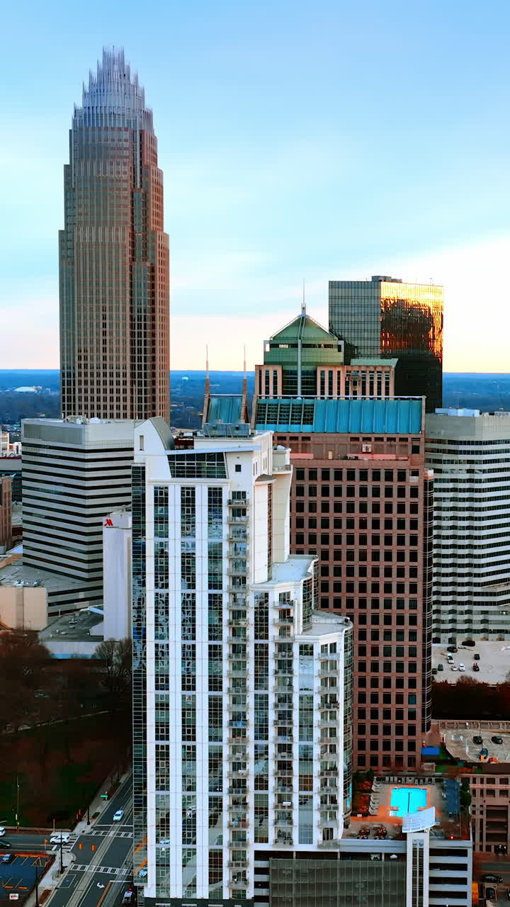 Gorgeous view of the stunning group of skyscrapers in the downtown of American city. Scenery of Charlotte, North Carolina, USA from aerial perspective. Vertical video