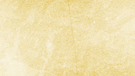 Animation-of-changing-textured-yellow-and-gold-backgrounds-with-copy-space