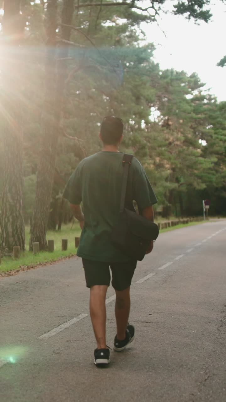 Man walking on a road in nature