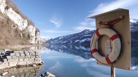 life belt in a stunning winter mountain and lake scenery