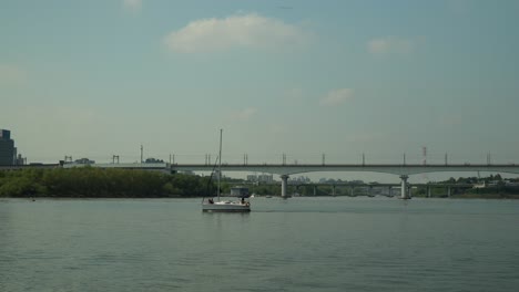 korean couple silhouette sitting on bow of small yacht during private cruise on hangang river near seoul marina club