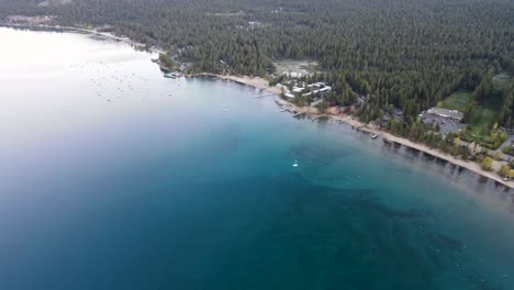 A-high-flying,-4K-drone-shot-over-anchored-boats-during-a-summertime-sunset,-off-the-coast-of-Lake-Tahoe,-California