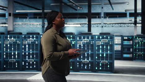 data center programmer uses tablet to develop disaster recovery plans