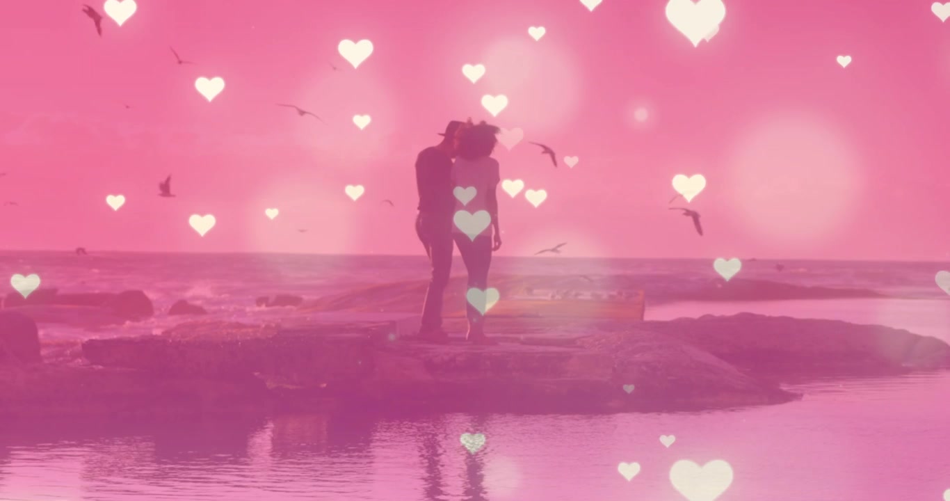 Animation of hearts over couple at beach