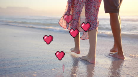 animation of hearts moving over legs of diverse couple in love on beach in summer