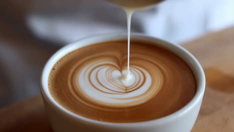 pouring milk into a latte
