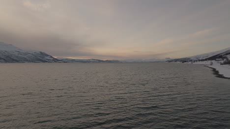 Beautiful-coastal-landscape-with-snow-capped-mountains-in-Scandinavia