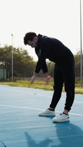 stretching before a basketball match at the park