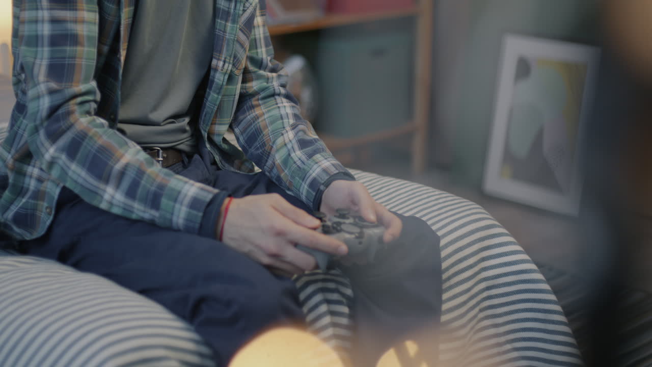 Teenager Playing Video Games in Bedroom