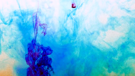 4k footage of colorful ink drops in water, isolated abstract background. pouring ink in water. underwater paint mix. slow psychedelic dye swirls, colored smoke explosion. splashing, floating liquid