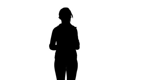 fit woman jogging to camera silhouette