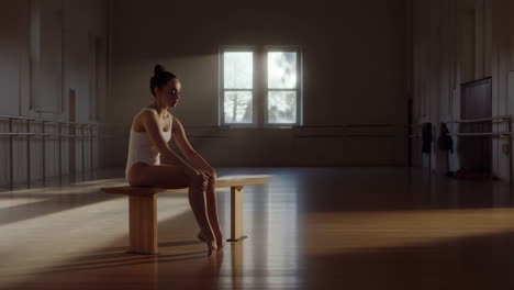 ballerina resting in a dance studio