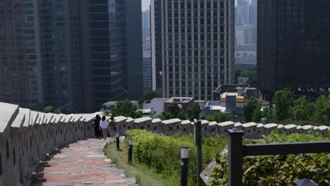 group of people walking through namsan park in seoul, south korea