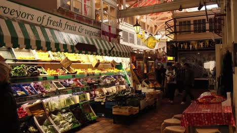 people shopping at a vibrant fruit market