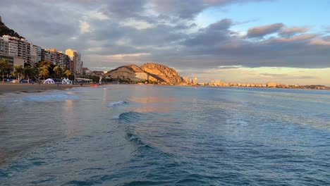 alicante golden hour with calm waves