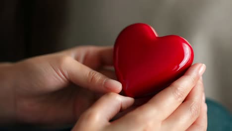 woman holding a red heart